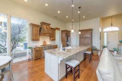 Indulge in the lap of luxury with this pristine, three-bedroom on Sunbrook Golf Course in Utah - for sale on GolfHomes.com, golf home, golf lot