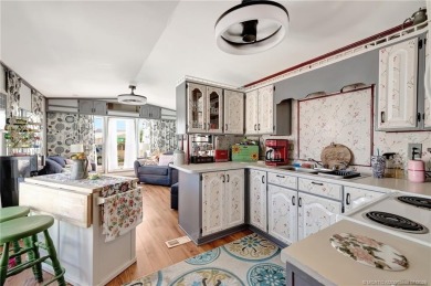 OFFERS WELCOME! This charming two-bedroom, one-bath home is on Island Dunes Country Club in Florida - for sale on GolfHomes.com, golf home, golf lot