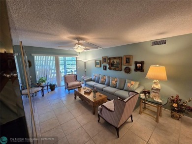 Enjoy golf course views from this beautifully maintained on Wynmoor Golf Course in Florida - for sale on GolfHomes.com, golf home, golf lot