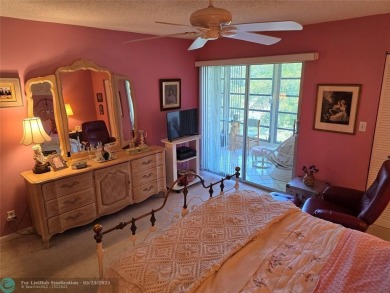 Enjoy golf course views from this beautifully maintained on Wynmoor Golf Course in Florida - for sale on GolfHomes.com, golf home, golf lot