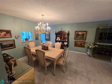Enjoy golf course views from this beautifully maintained on Wynmoor Golf Course in Florida - for sale on GolfHomes.com, golf home, golf lot