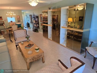 Enjoy golf course views from this beautifully maintained on Wynmoor Golf Course in Florida - for sale on GolfHomes.com, golf home, golf lot