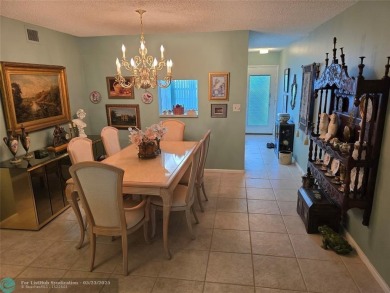 Enjoy golf course views from this beautifully maintained on Wynmoor Golf Course in Florida - for sale on GolfHomes.com, golf home, golf lot