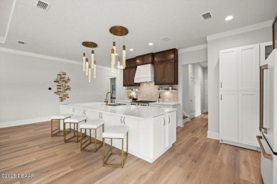 This stunning Hulbert Homes model in Veranda Bay isn't just on Ocean Palm Golf Course in Florida - for sale on GolfHomes.com, golf home, golf lot