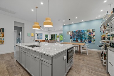A house with modern finishes and amazing vintage decor combines on Palm Beach Polo and Country Club in Florida - for sale on GolfHomes.com, golf home, golf lot