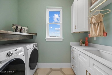 This stunning Hulbert Homes model in Veranda Bay isn't just on Ocean Palm Golf Course in Florida - for sale on GolfHomes.com, golf home, golf lot