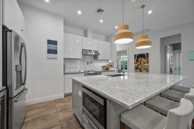 A house with modern finishes and amazing vintage decor combines on Palm Beach Polo and Country Club in Florida - for sale on GolfHomes.com, golf home, golf lot