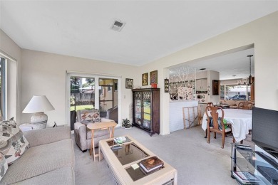 This charming 3-bedroom, 2-bathroom home offers the perfect on Fort Lauderdale Country Club in Florida - for sale on GolfHomes.com, golf home, golf lot