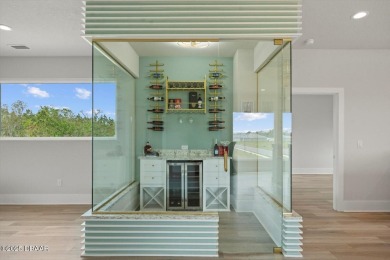 This stunning Hulbert Homes model in Veranda Bay isn't just on Ocean Palm Golf Course in Florida - for sale on GolfHomes.com, golf home, golf lot