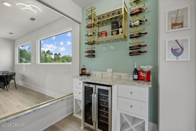 This stunning Hulbert Homes model in Veranda Bay isn't just on Ocean Palm Golf Course in Florida - for sale on GolfHomes.com, golf home, golf lot