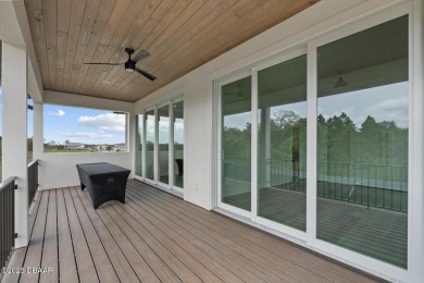 This stunning Hulbert Homes model in Veranda Bay isn't just on Ocean Palm Golf Course in Florida - for sale on GolfHomes.com, golf home, golf lot