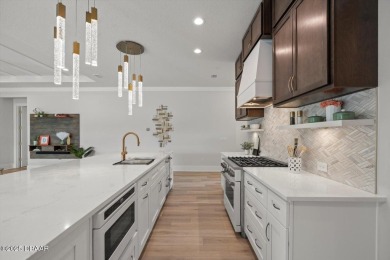 This stunning Hulbert Homes model in Veranda Bay isn't just on Ocean Palm Golf Course in Florida - for sale on GolfHomes.com, golf home, golf lot
