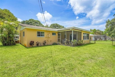 This charming 3-bedroom, 2-bathroom home offers the perfect on Fort Lauderdale Country Club in Florida - for sale on GolfHomes.com, golf home, golf lot