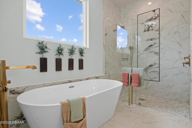 This stunning Hulbert Homes model in Veranda Bay isn't just on Ocean Palm Golf Course in Florida - for sale on GolfHomes.com, golf home, golf lot