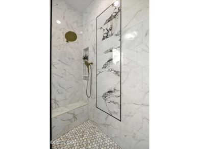 This stunning Hulbert Homes model in Veranda Bay isn't just on Ocean Palm Golf Course in Florida - for sale on GolfHomes.com, golf home, golf lot