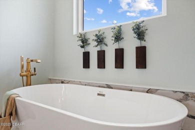 This stunning Hulbert Homes model in Veranda Bay isn't just on Ocean Palm Golf Course in Florida - for sale on GolfHomes.com, golf home, golf lot