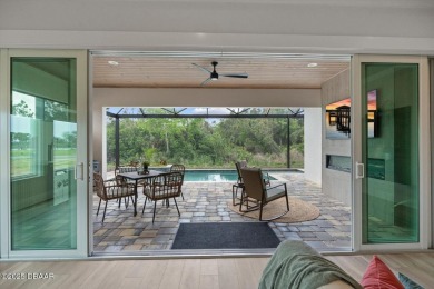 This stunning Hulbert Homes model in Veranda Bay isn't just on Ocean Palm Golf Course in Florida - for sale on GolfHomes.com, golf home, golf lot
