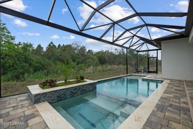 This stunning Hulbert Homes model in Veranda Bay isn't just on Ocean Palm Golf Course in Florida - for sale on GolfHomes.com, golf home, golf lot