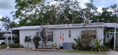 TWO BEDROOM, 1 1/2 BATHROOM MOBILE HOME IN ACTIVE 55+ COMMUNITY on River Run Golf Links in Florida - for sale on GolfHomes.com, golf home, golf lot