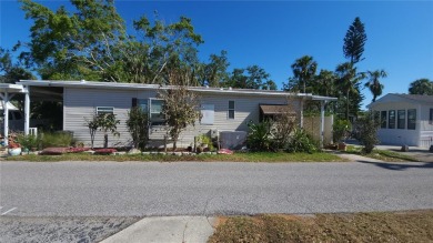TWO BEDROOM, 1 1/2 BATHROOM MOBILE HOME IN ACTIVE 55+ COMMUNITY on River Run Golf Links in Florida - for sale on GolfHomes.com, golf home, golf lot
