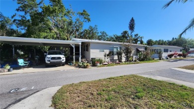 TWO BEDROOM, 1 1/2 BATHROOM MOBILE HOME IN ACTIVE 55+ COMMUNITY on River Run Golf Links in Florida - for sale on GolfHomes.com, golf home, golf lot