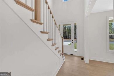This beautiful two-story home on a full unfinished basement is on The Plantation Golf Club in Georgia - for sale on GolfHomes.com, golf home, golf lot