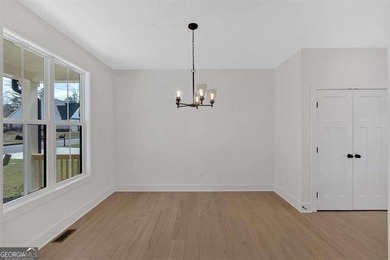 This beautiful two-story home on a full unfinished basement is on The Plantation Golf Club in Georgia - for sale on GolfHomes.com, golf home, golf lot