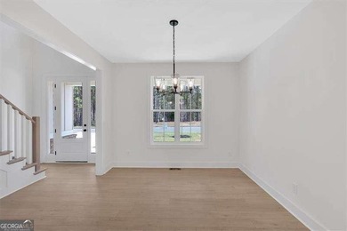 This beautiful two-story home on a full unfinished basement is on The Plantation Golf Club in Georgia - for sale on GolfHomes.com, golf home, golf lot