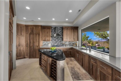 Stunning views and walls of glass bring the red rocks and on Entrada at Snow Canyon in Utah - for sale on GolfHomes.com, golf home, golf lot