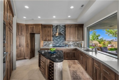 Stunning views and walls of glass bring the red rocks and on Entrada at Snow Canyon in Utah - for sale on GolfHomes.com, golf home, golf lot