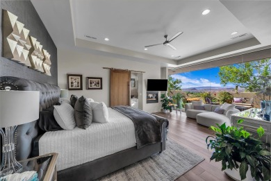 Stunning views and walls of glass bring the red rocks and on Entrada at Snow Canyon in Utah - for sale on GolfHomes.com, golf home, golf lot