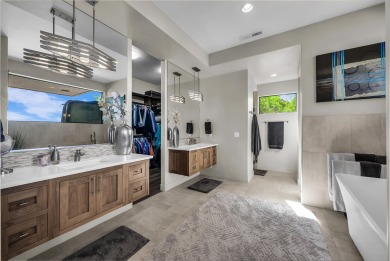 Stunning views and walls of glass bring the red rocks and on Entrada at Snow Canyon in Utah - for sale on GolfHomes.com, golf home, golf lot