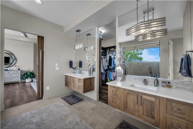 Stunning views and walls of glass bring the red rocks and on Entrada at Snow Canyon in Utah - for sale on GolfHomes.com, golf home, golf lot
