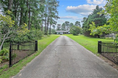 Live the dream in this stunning home on the golf course just on Cypress Lakes Golf Course in North Carolina - for sale on GolfHomes.com, golf home, golf lot