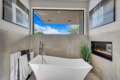 Stunning views and walls of glass bring the red rocks and on Entrada at Snow Canyon in Utah - for sale on GolfHomes.com, golf home, golf lot