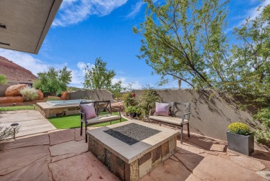 Stunning views and walls of glass bring the red rocks and on Entrada at Snow Canyon in Utah - for sale on GolfHomes.com, golf home, golf lot