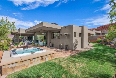 Stunning views and walls of glass bring the red rocks and on Entrada at Snow Canyon in Utah - for sale on GolfHomes.com, golf home, golf lot