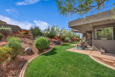 Stunning views and walls of glass bring the red rocks and on Entrada at Snow Canyon in Utah - for sale on GolfHomes.com, golf home, golf lot