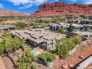 Stunning views and walls of glass bring the red rocks and on Entrada at Snow Canyon in Utah - for sale on GolfHomes.com, golf home, golf lot
