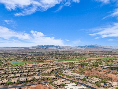Stunning views and walls of glass bring the red rocks and on Entrada at Snow Canyon in Utah - for sale on GolfHomes.com, golf home, golf lot