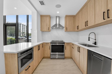 Completely renovated and refined, this two-bedroom, two-bath on Boca West Golf and Country Club in Florida - for sale on GolfHomes.com, golf home, golf lot