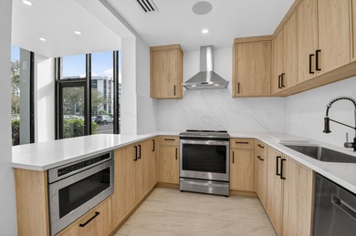 Completely renovated and refined, this two-bedroom, two-bath on Boca West Golf and Country Club in Florida - for sale on GolfHomes.com, golf home, golf lot