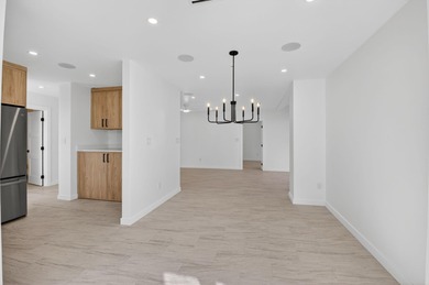 Completely renovated and refined, this two-bedroom, two-bath on Boca West Golf and Country Club in Florida - for sale on GolfHomes.com, golf home, golf lot