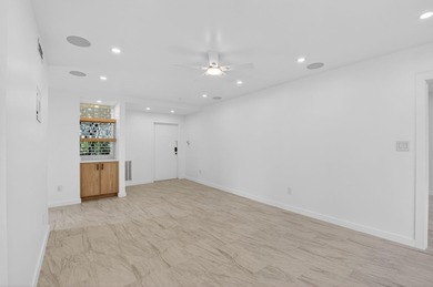 Completely renovated and refined, this two-bedroom, two-bath on Boca West Golf and Country Club in Florida - for sale on GolfHomes.com, golf home, golf lot