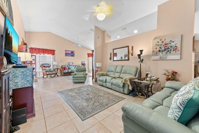 From the moment you approach, this radiant home invites you into on Cypress Lakes Golf Course - West Palm Beach in Florida - for sale on GolfHomes.com, golf home, golf lot