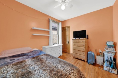 Charming brick bungalow offering 3 bedrooms, 1 full bath, a on Marquette Park Golf Course in Illinois - for sale on GolfHomes.com, golf home, golf lot