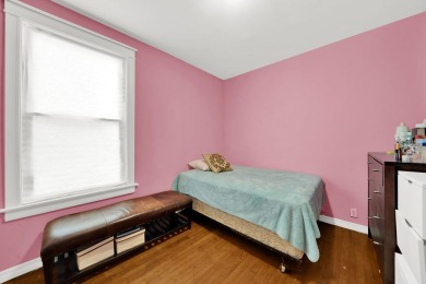 Charming brick bungalow offering 3 bedrooms, 1 full bath, a on Marquette Park Golf Course in Illinois - for sale on GolfHomes.com, golf home, golf lot
