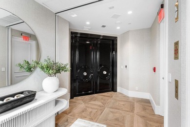 Beyond the private gates of Boca Grove Country Club, a residence on Boca Grove Golf and Tennis in Florida - for sale on GolfHomes.com, golf home, golf lot