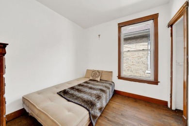 Charming brick bungalow offering 3 bedrooms, 1 full bath, a on Marquette Park Golf Course in Illinois - for sale on GolfHomes.com, golf home, golf lot