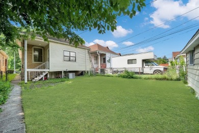 Charming brick bungalow offering 3 bedrooms, 1 full bath, a on Marquette Park Golf Course in Illinois - for sale on GolfHomes.com, golf home, golf lot